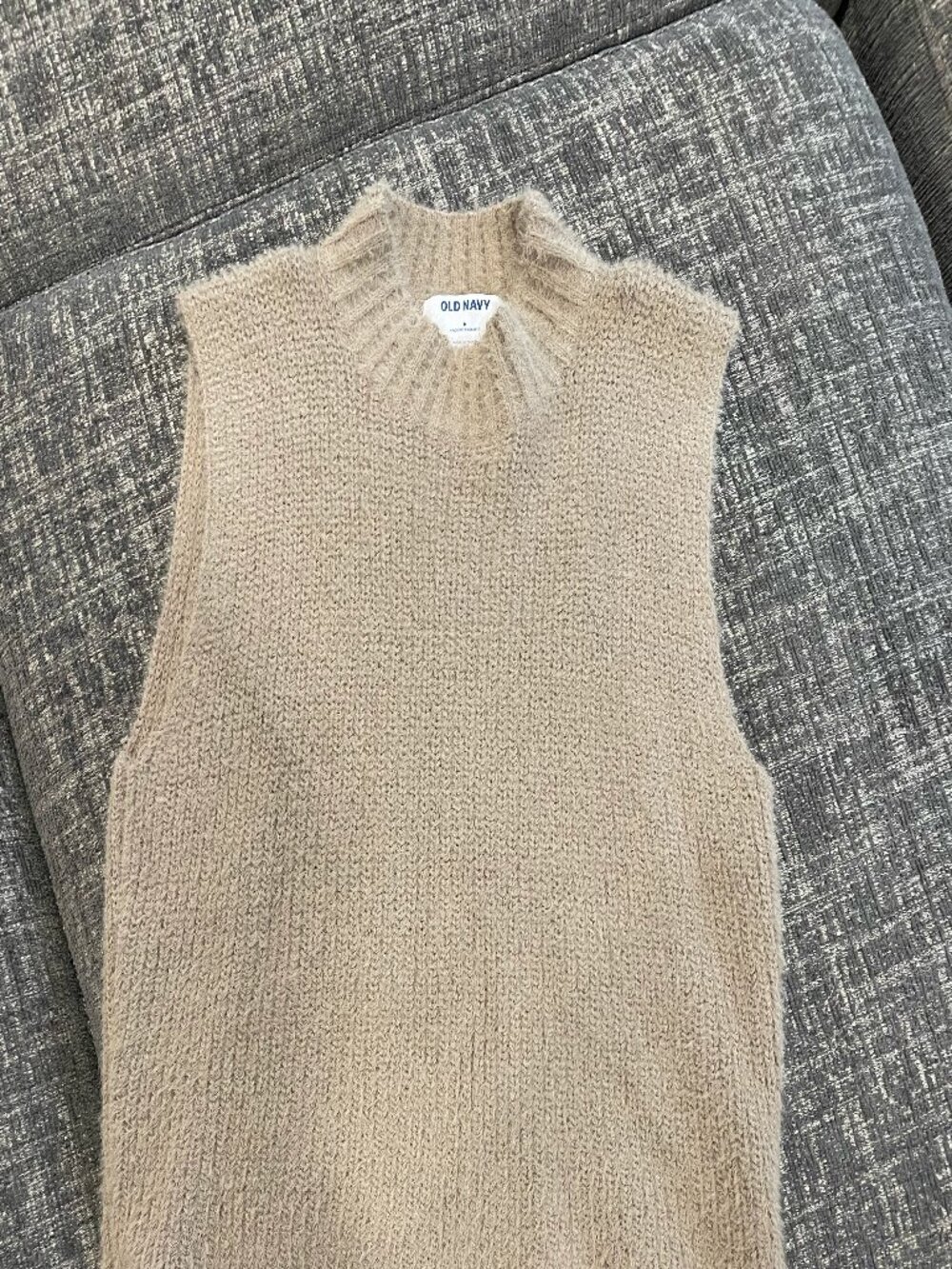 size medium oatmeal colored sleeveless top.